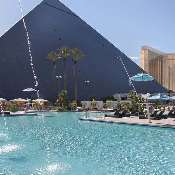 West facing pool image with water feature.