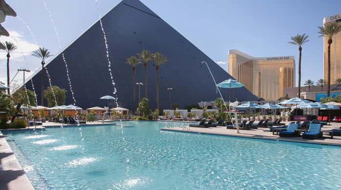 West facing pool image with water feature.