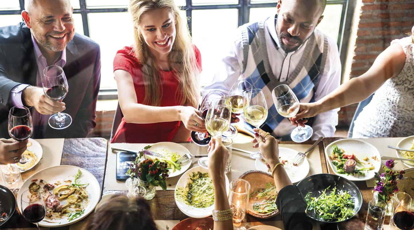 Group of People Eating at Table.