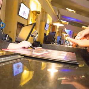 Friendly agents assist guests at Luxor's Front Desk.